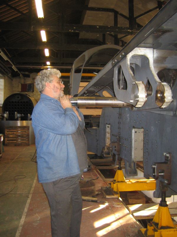 Installing a shaft -- by hand! Picture of locomotive works